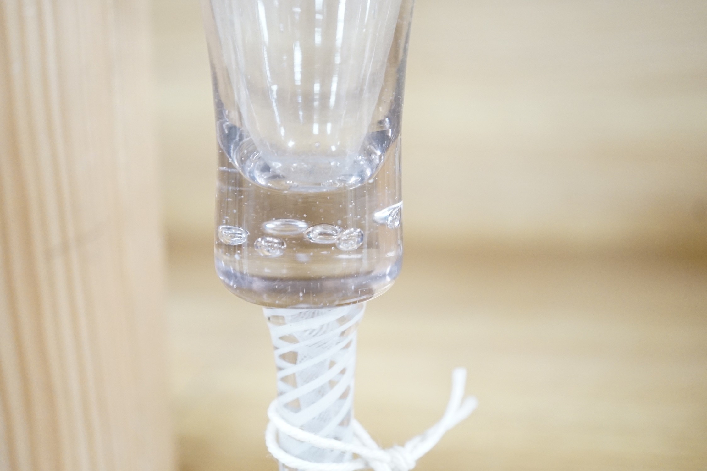 A trio of George III style cotton twist stemmed glasses, 17.5cms high